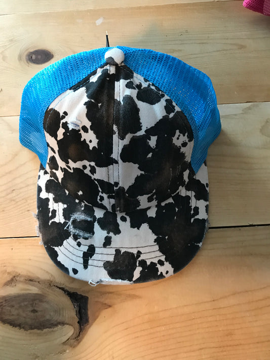 Turquoise cow criss cross ponytail hat