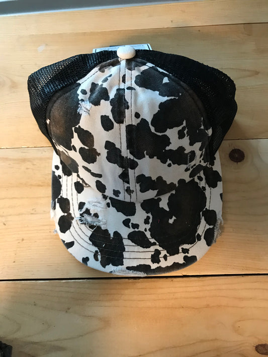 Black cow criss cross ponytail hat